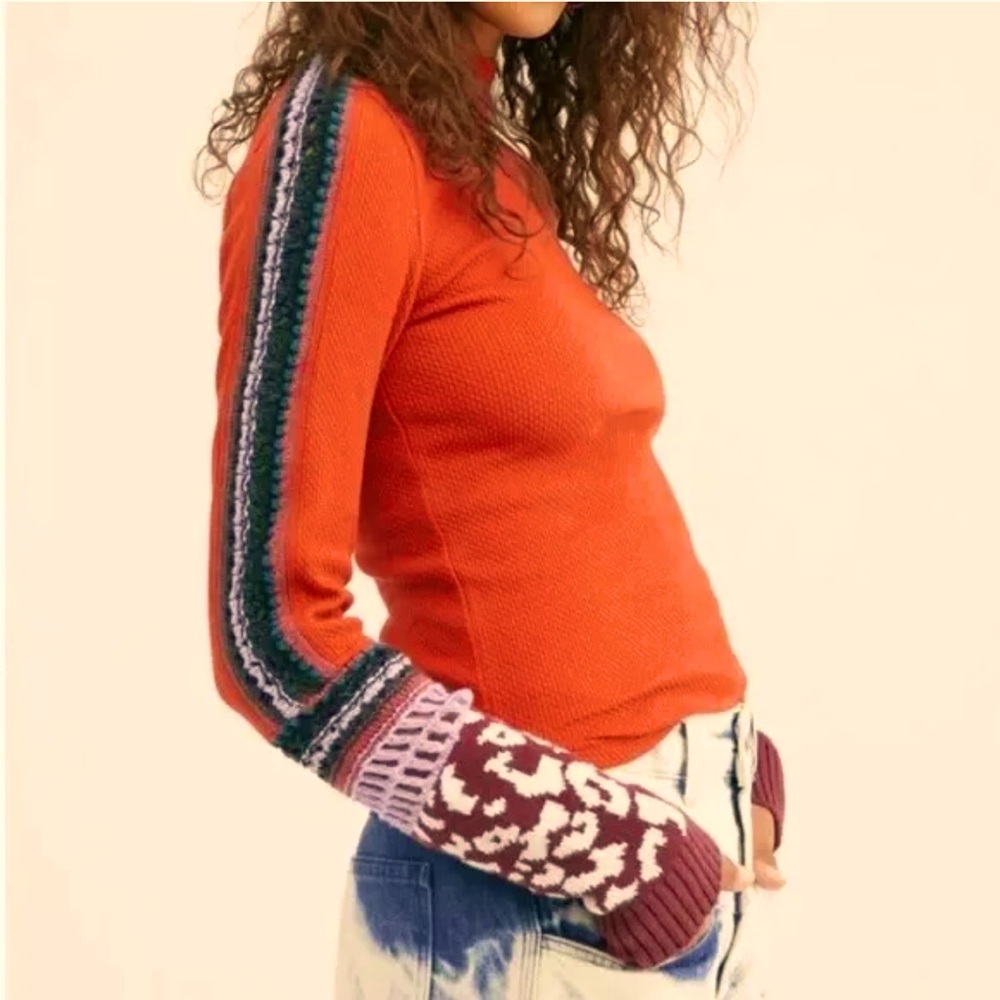 Free People “switch it up cuff” light sweater.
